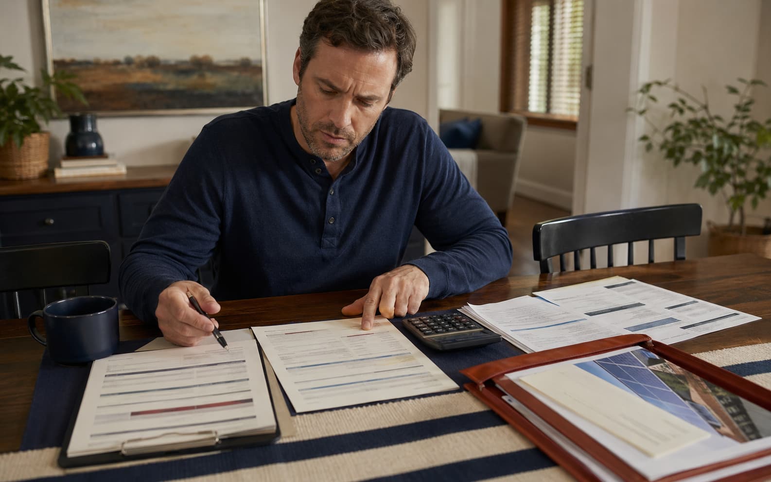 Solar contract, financing paperwork, utility bills, and sales notes arranged for review